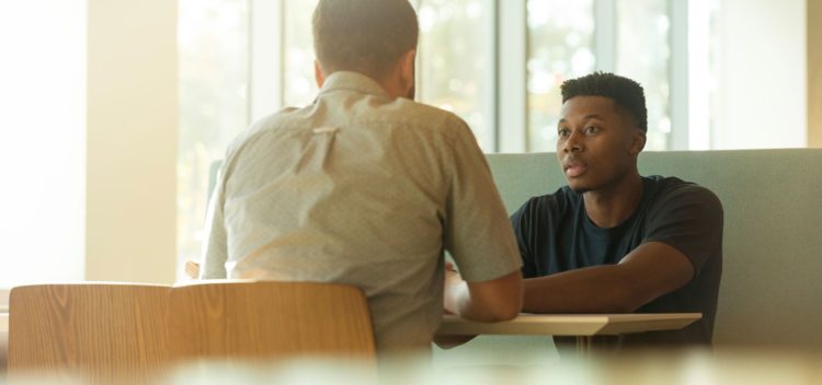 Man interviewing other man