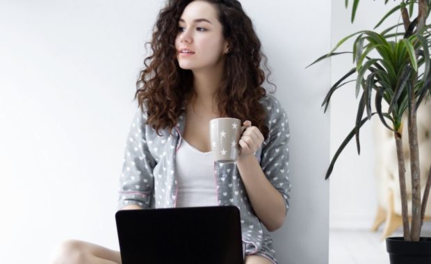 woman coffee mug laptop
